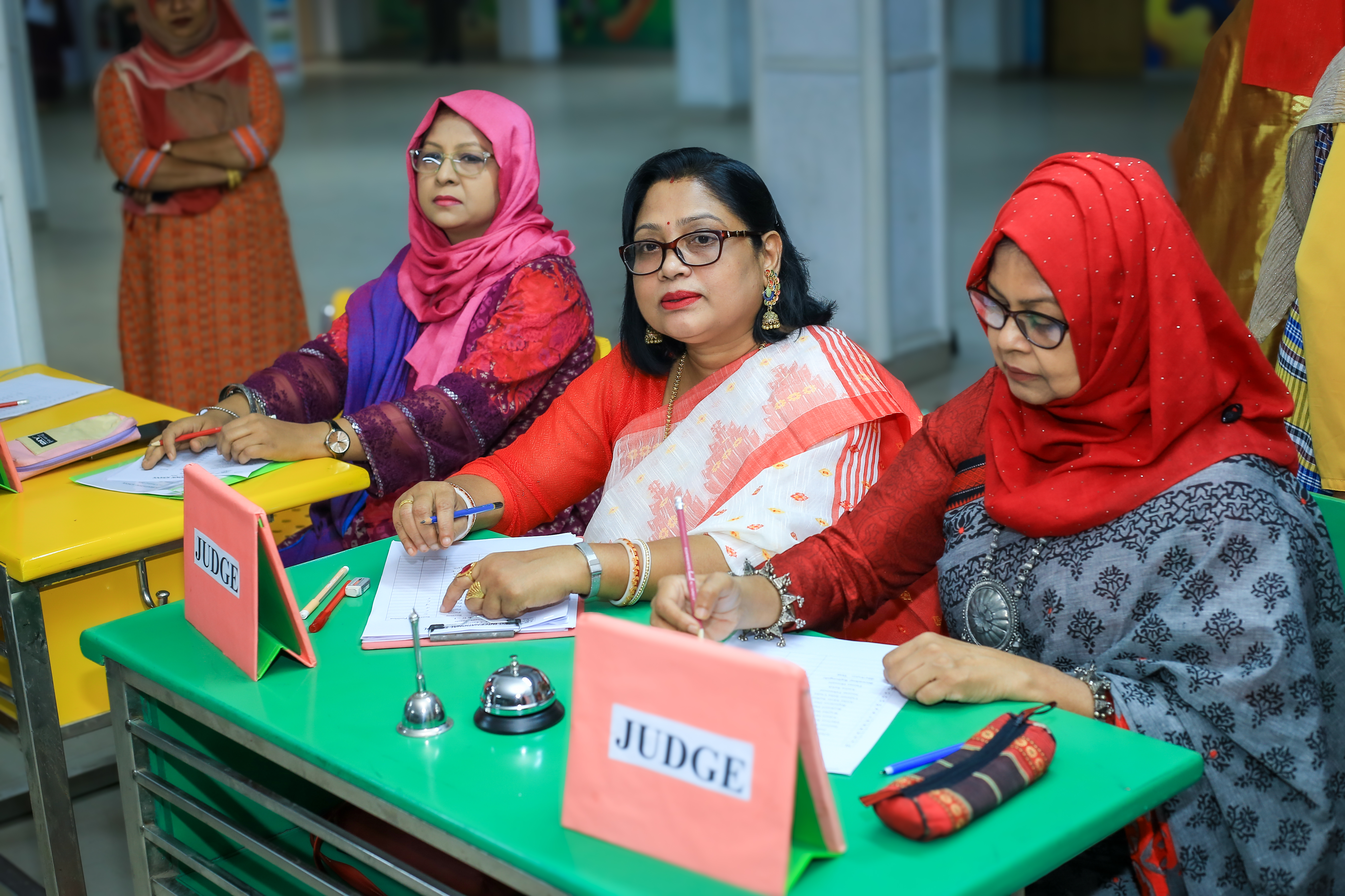 Judges and teachers watching the student performances during the festival